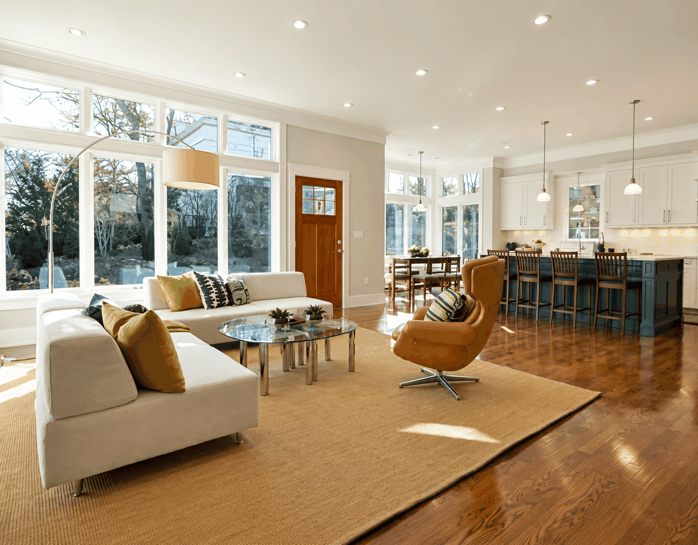 Open-concept living and dining area connected to a remodeled kitchen